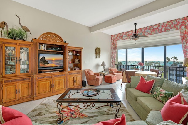 living room featuring light tile patterned floors, beam ceiling, and a ceiling fan