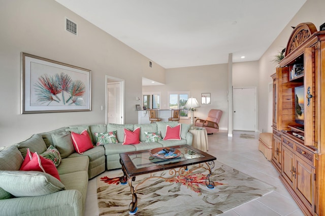 living room featuring visible vents and light tile patterned floors