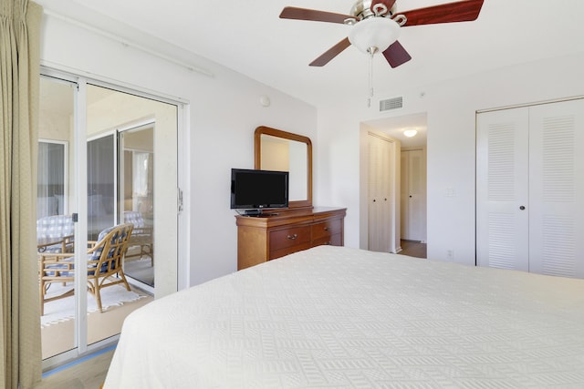 bedroom with a ceiling fan, two closets, visible vents, and access to exterior