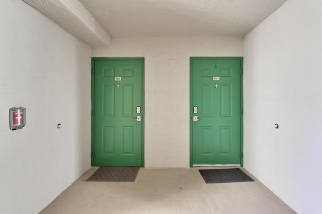 view of exterior entry with stucco siding