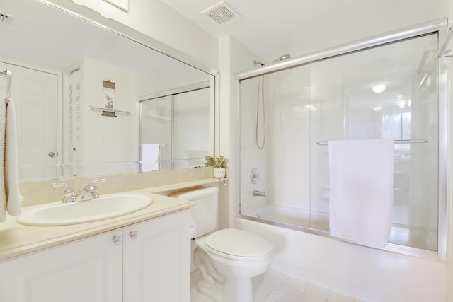 full bathroom featuring shower / bath combination with glass door, visible vents, toilet, vanity, and tile patterned flooring