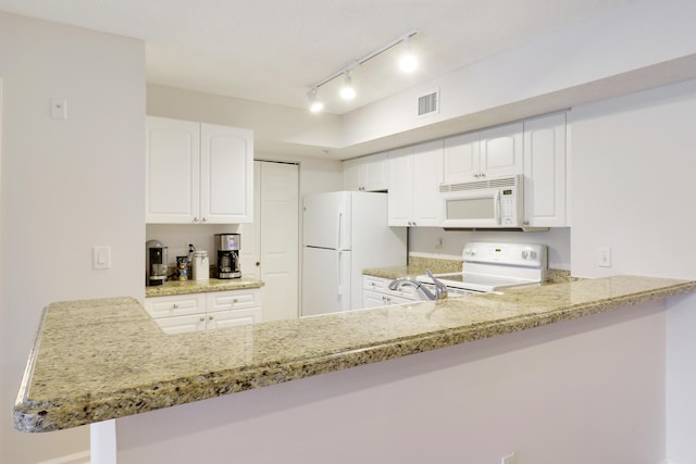 kitchen featuring white cabinets, white appliances, visible vents, and light stone countertops