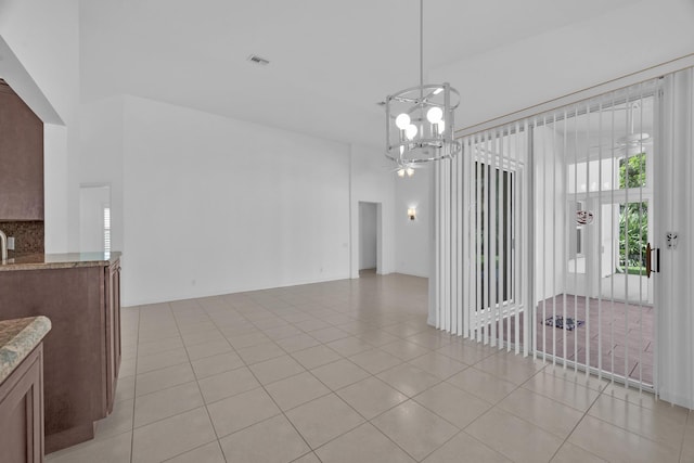 dining room featuring visible vents, a notable chandelier, and light tile patterned flooring