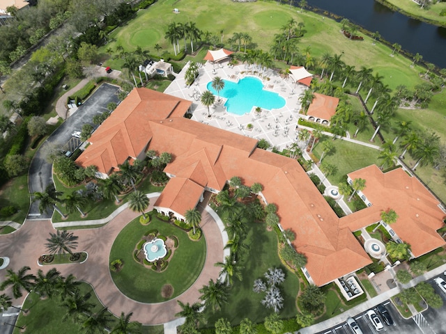 aerial view featuring golf course view and a water view