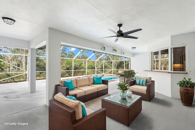 sunroom / solarium featuring ceiling fan and a wealth of natural light