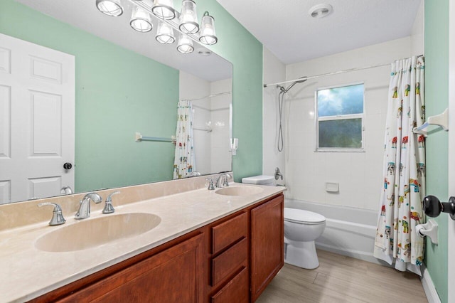 full bathroom with toilet, shower / bathtub combination with curtain, a sink, and wood finished floors