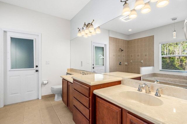 bathroom featuring tiled shower, toilet, a sink, tile patterned flooring, and two vanities