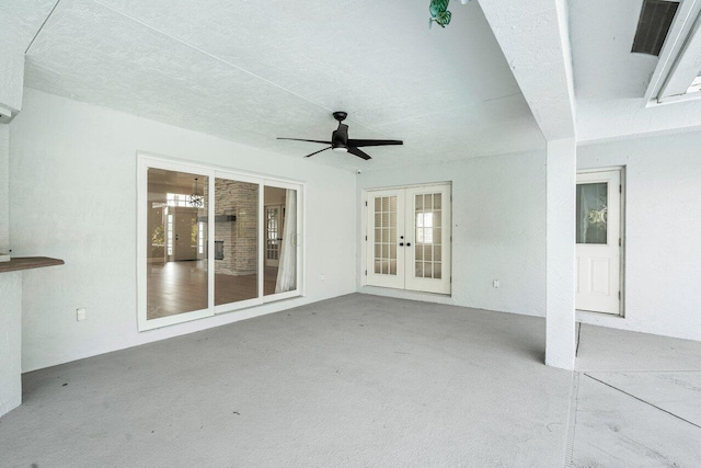 view of patio / terrace featuring french doors and ceiling fan