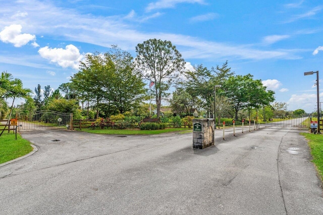 view of street featuring a gate and a gated entry