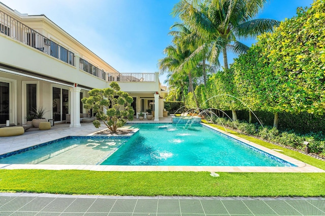 view of swimming pool with a patio and a fenced in pool