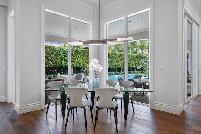 dining room with hardwood / wood-style floors and baseboards