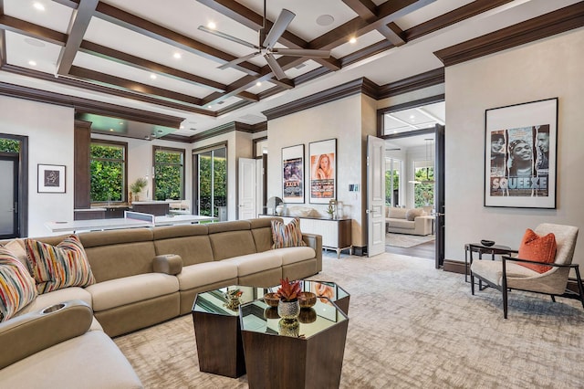 living area featuring beam ceiling, light carpet, coffered ceiling, and ceiling fan