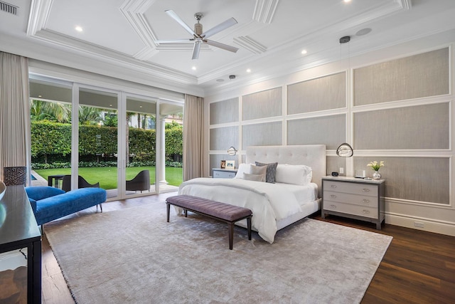 bedroom with dark wood-style floors, access to exterior, a decorative wall, and crown molding