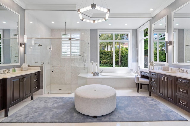 bathroom featuring vanity, a garden tub, a stall shower, and ornamental molding