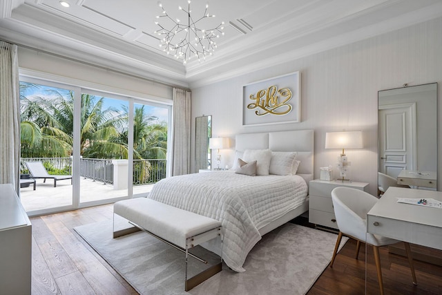 bedroom featuring an inviting chandelier, access to exterior, hardwood / wood-style floors, and ornamental molding