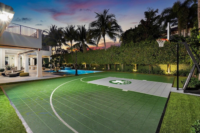 view of sport court featuring community basketball court and an outdoor pool