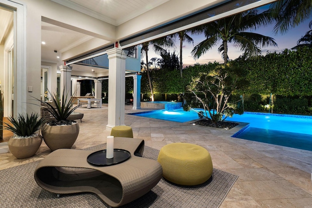 pool with a patio area, outdoor dining area, and a hot tub