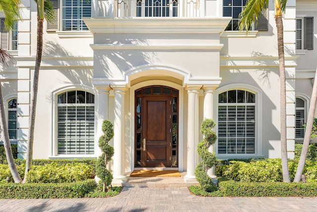 doorway to property with stucco siding