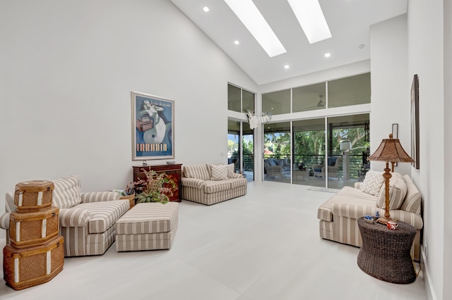 living room with high vaulted ceiling, a skylight, and recessed lighting