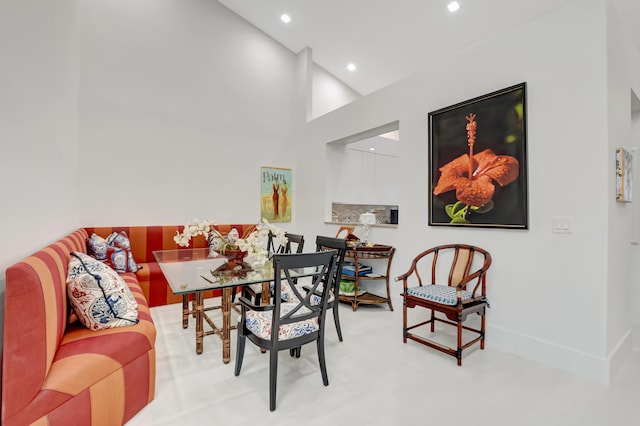 dining space with recessed lighting and baseboards