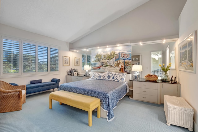 bedroom featuring lofted ceiling and carpet flooring