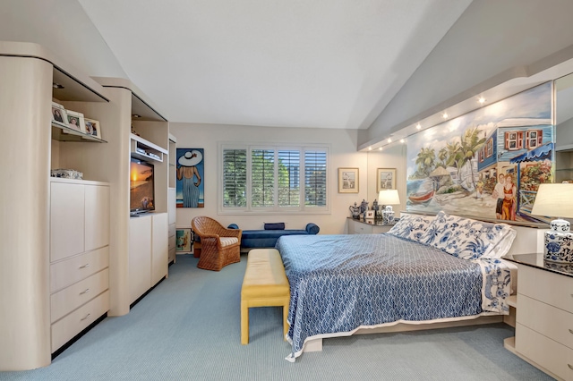 carpeted bedroom with vaulted ceiling