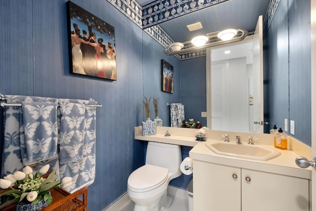 bathroom with vanity and toilet