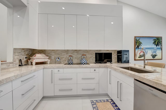 kitchen featuring white cabinets, dishwasher, a sink, and modern cabinets