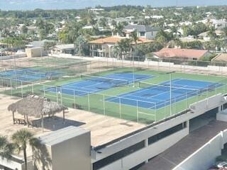 view of sport court with fence