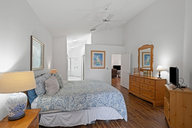 bedroom with high vaulted ceiling, visible vents, connected bathroom, and wood finished floors