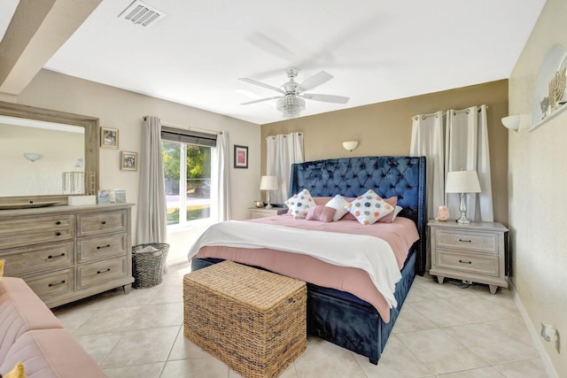 bedroom featuring light tile patterned floors, visible vents, baseboards, and ceiling fan