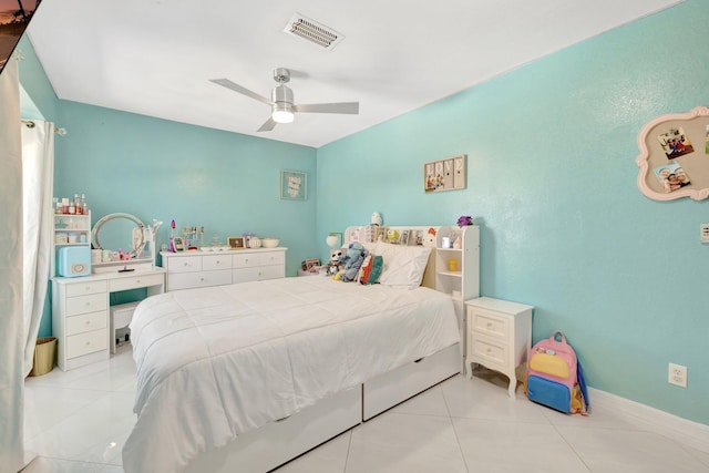 bedroom with light tile patterned floors, visible vents, and ceiling fan