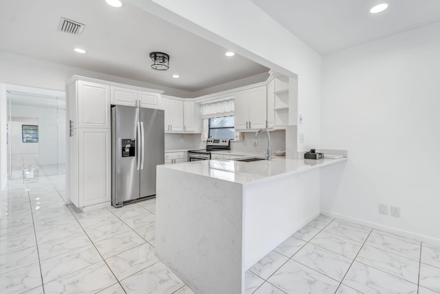 kitchen featuring appliances with stainless steel finishes, marble finish floor, visible vents, and a sink