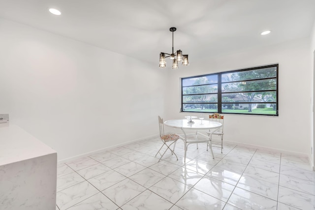 unfurnished dining area featuring marble finish floor, recessed lighting, baseboards, and an inviting chandelier