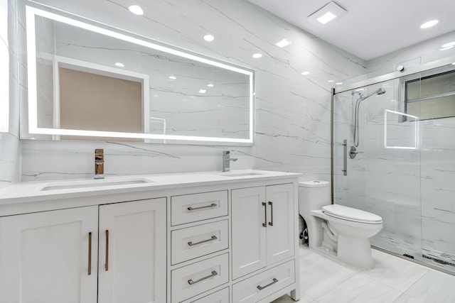 full bath featuring toilet, a sink, tile walls, marble finish floor, and a marble finish shower