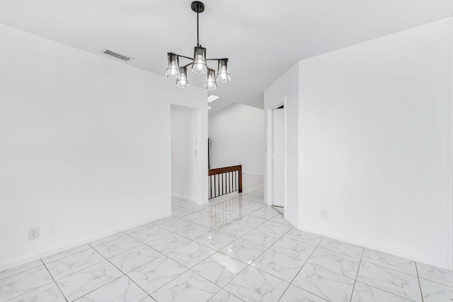 spare room with baseboards, marble finish floor, visible vents, and a notable chandelier