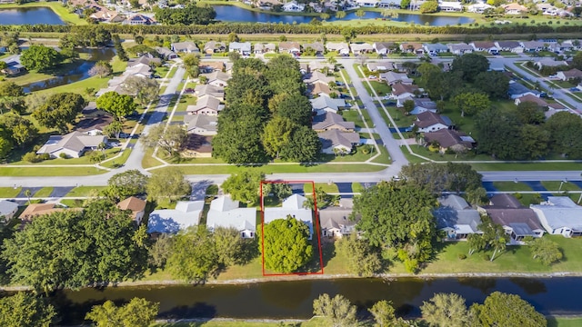 aerial view featuring a residential view and a water view