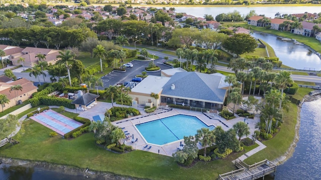 birds eye view of property featuring a residential view and a water view