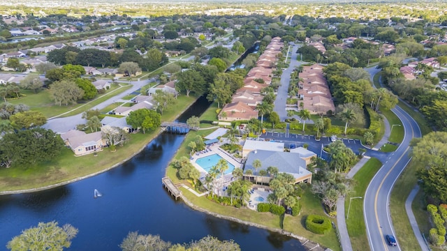 birds eye view of property featuring a water view and a residential view