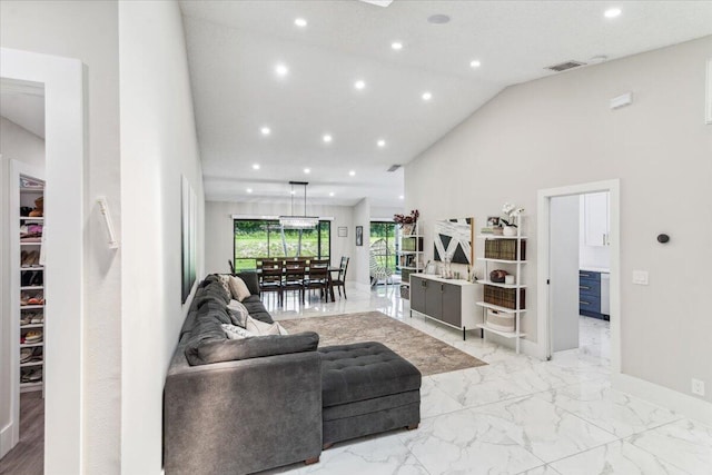 living area with visible vents, high vaulted ceiling, marble finish floor, recessed lighting, and baseboards