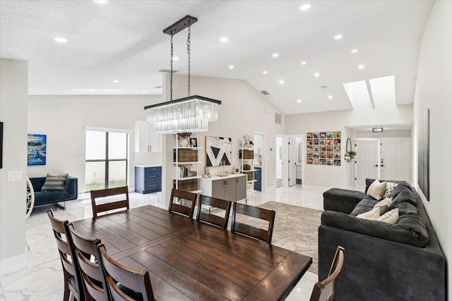 dining room with visible vents, high vaulted ceiling, recessed lighting, a textured ceiling, and marble finish floor