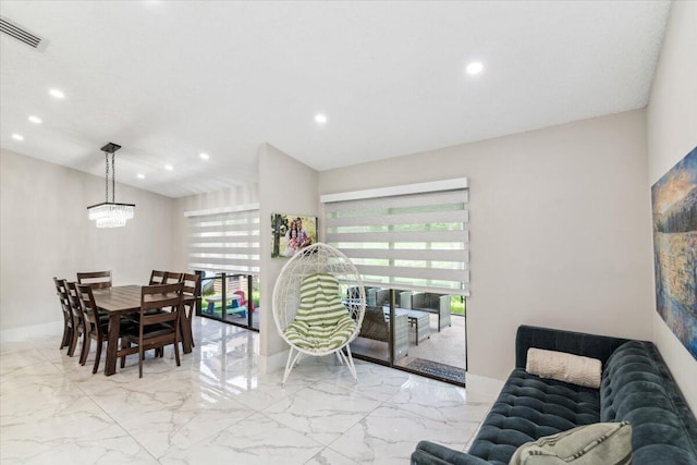 dining space featuring an inviting chandelier, recessed lighting, visible vents, and marble finish floor