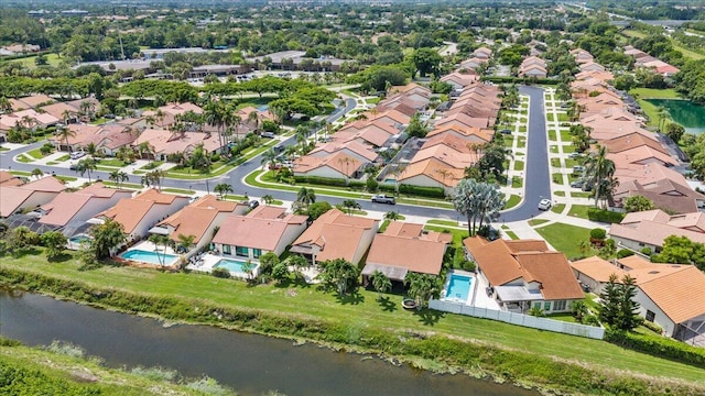 bird's eye view with a residential view and a water view