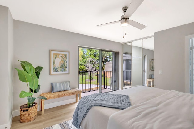 bedroom featuring a ceiling fan, access to outside, baseboards, and light wood finished floors