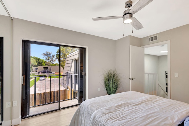 bedroom with access to exterior, visible vents, ceiling fan, and light wood finished floors