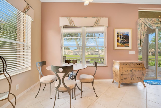 dining room with plenty of natural light, baseboards, and light tile patterned floors