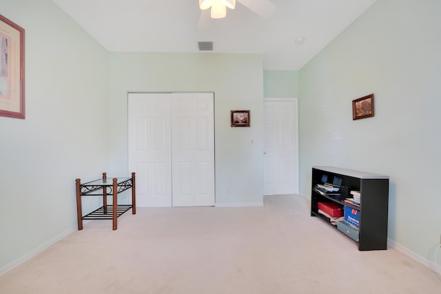 interior space featuring ceiling fan, visible vents, baseboards, a closet, and carpet