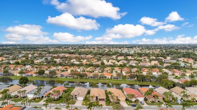 bird's eye view featuring a water view and a residential view