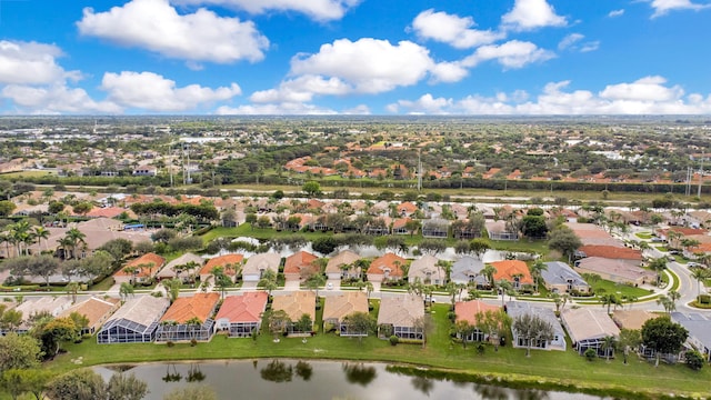 birds eye view of property featuring a water view and a residential view