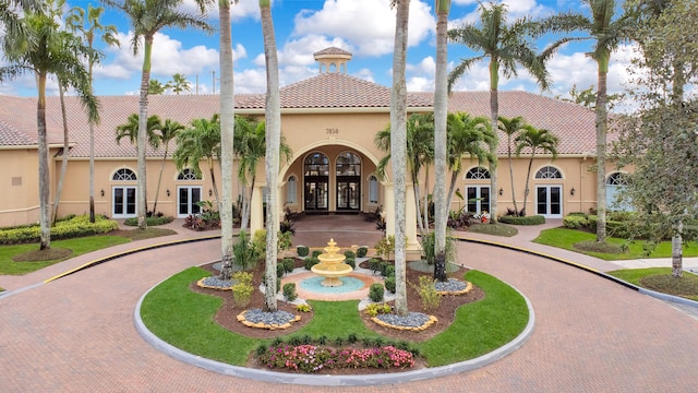 view of property featuring curved driveway